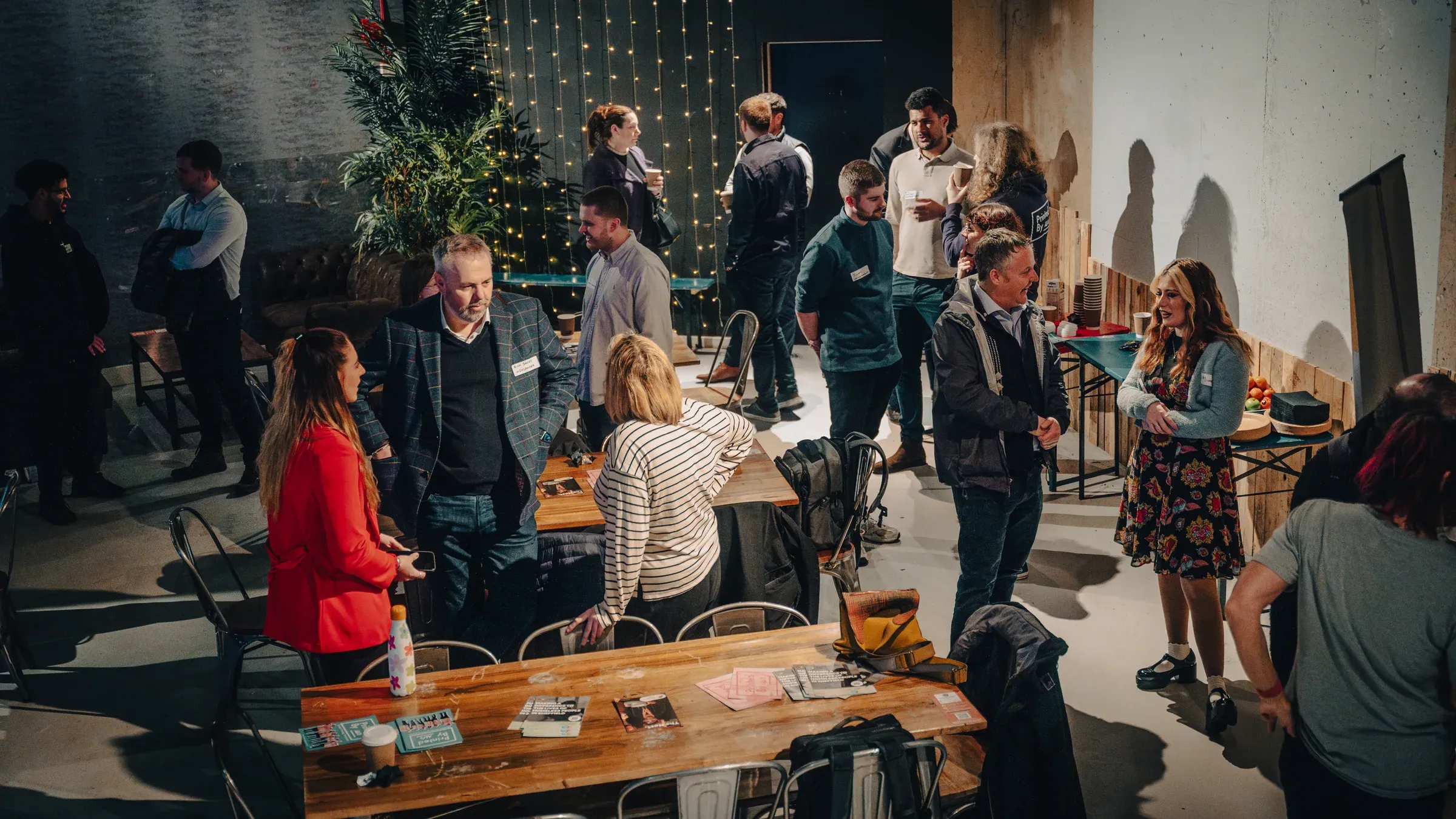Guests mingling and chatting at a corporate networking event, captured by Unit Studio